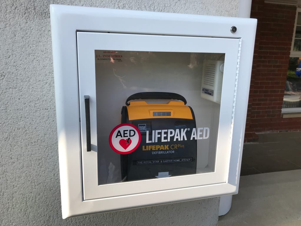 Charity provides defibrillator for local community following life threatening incidents 1Stop